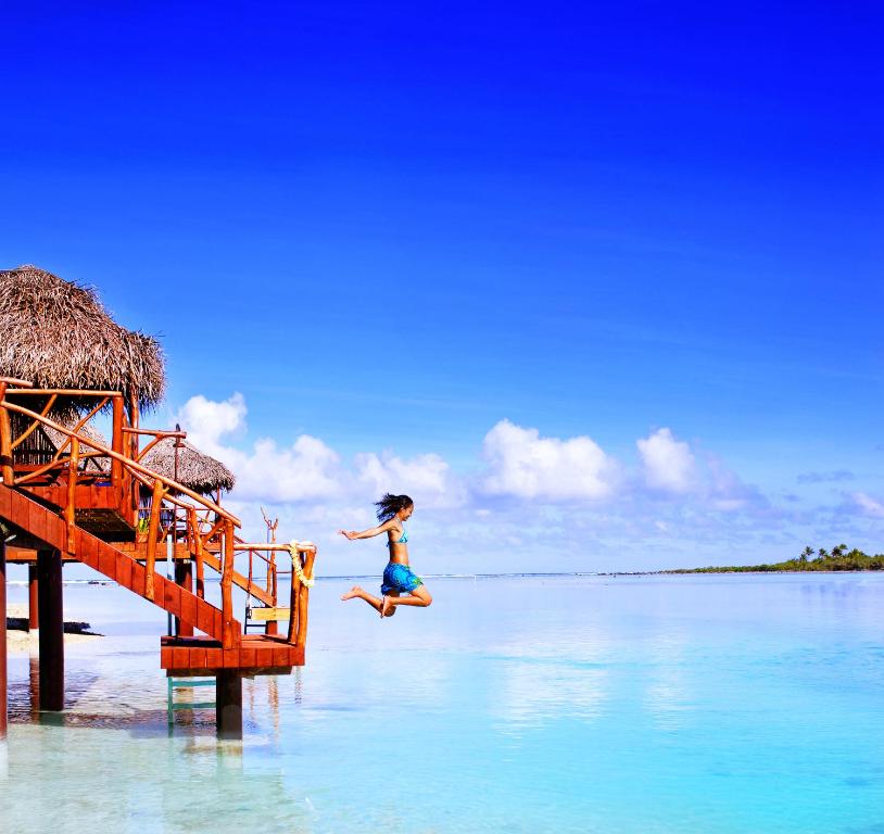 Aitutaki Lagoon Private Island Resort - Jumping from Water Bungalows