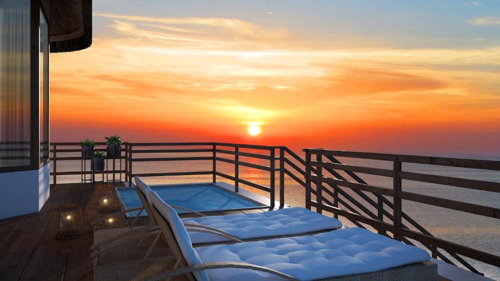 Konokono Beach Resort and Isaraya Luxury Overwater Villas - Deck Sunset