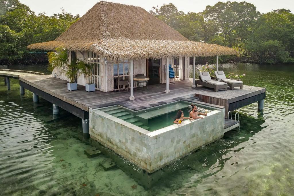 Nayara Bocas del Toro - Water Bungalows couple in pool