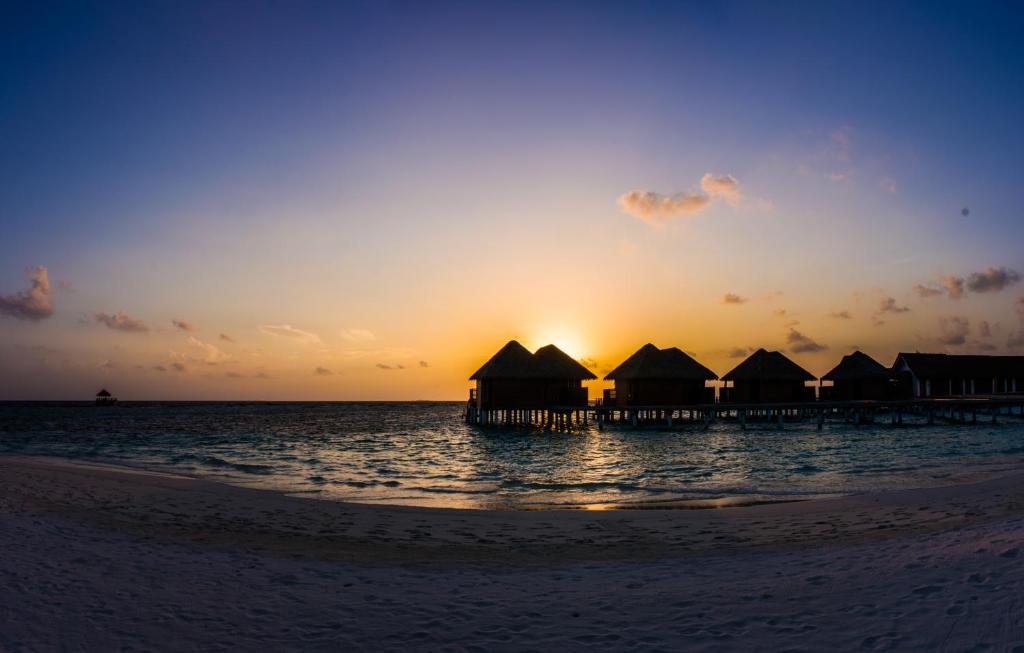 Kandolhu Maldives - Water Bungalows and Sunset