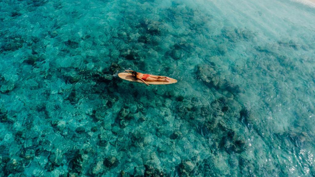 Soneva Fushi - Girl on Surfboard