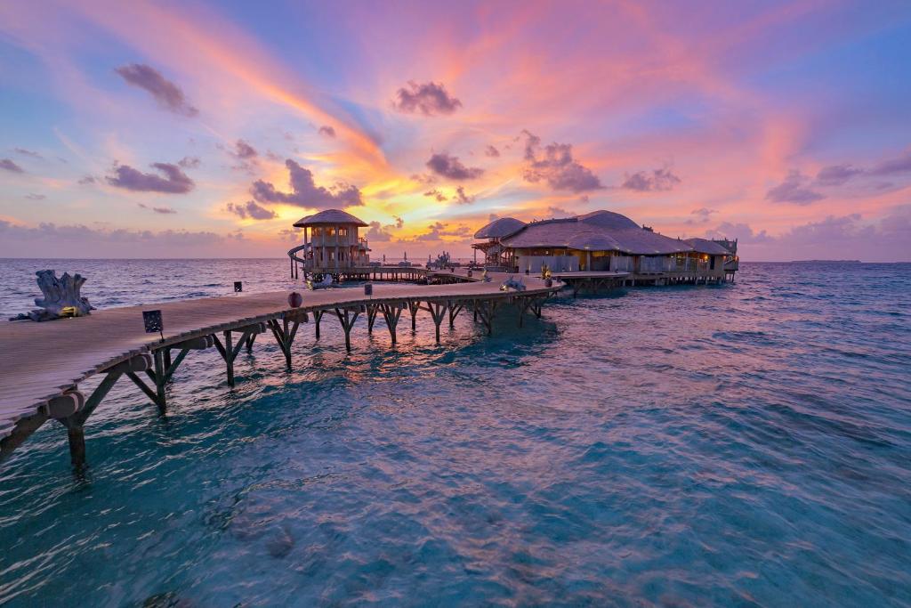 Soneva Fushi - Water Bungalows in Colors of Sunset