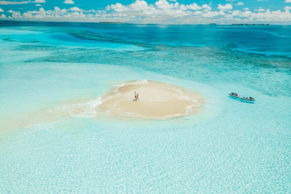 reethi faru resort sand beach